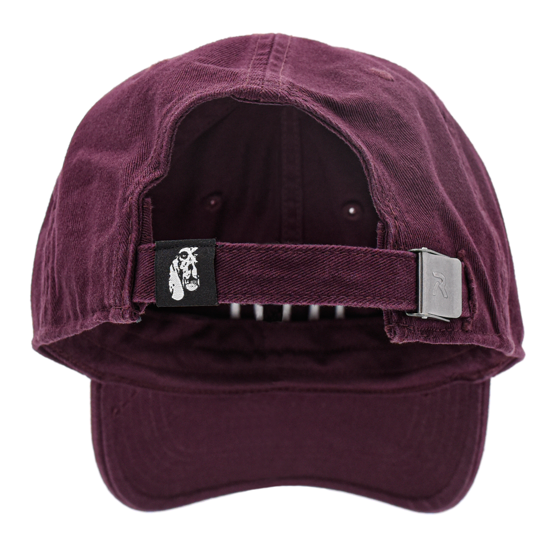 maroon dad hat baseball hat with small carbon hound logo tag on the back adjustable portion