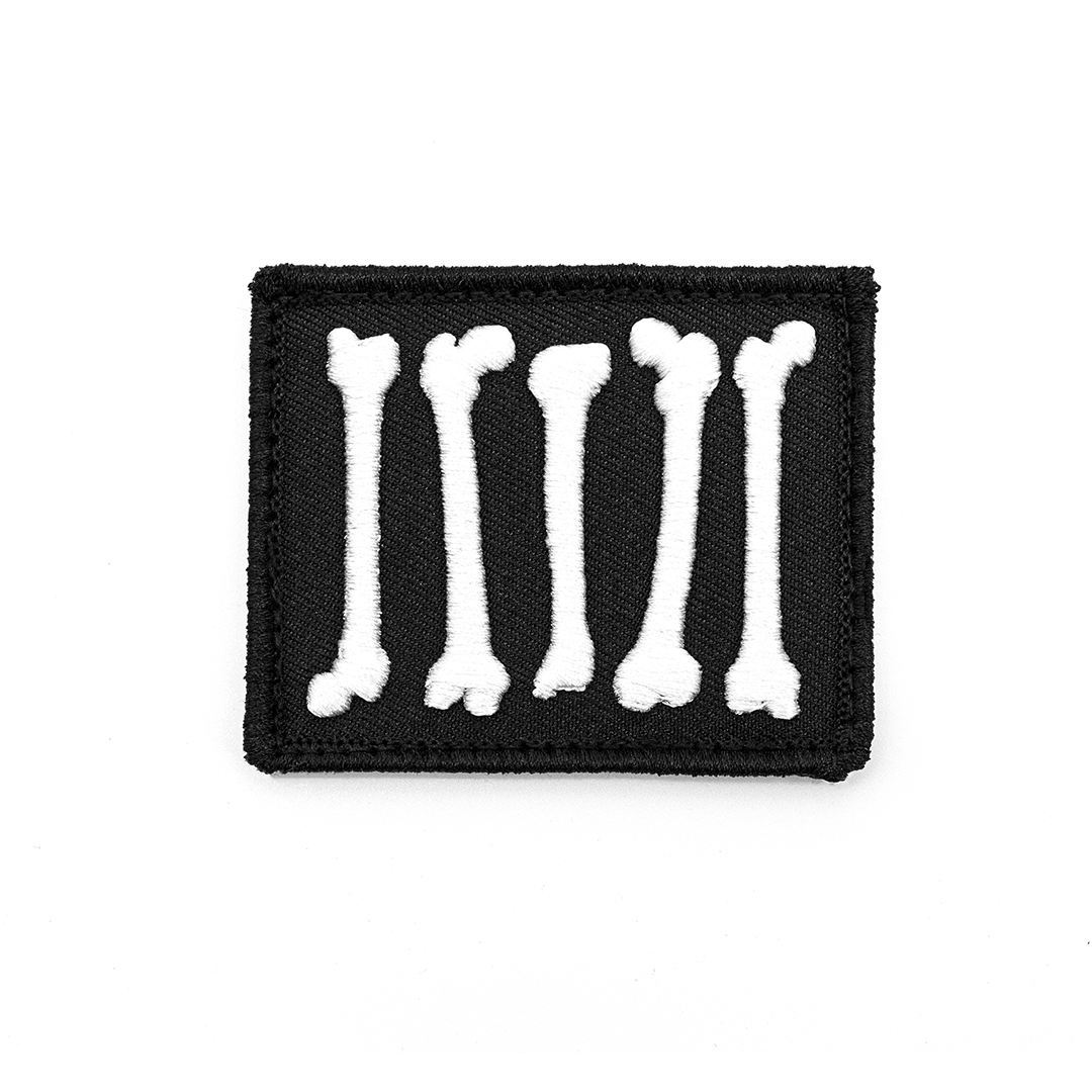 carbon hound rebel bones embroidered patch on a white background